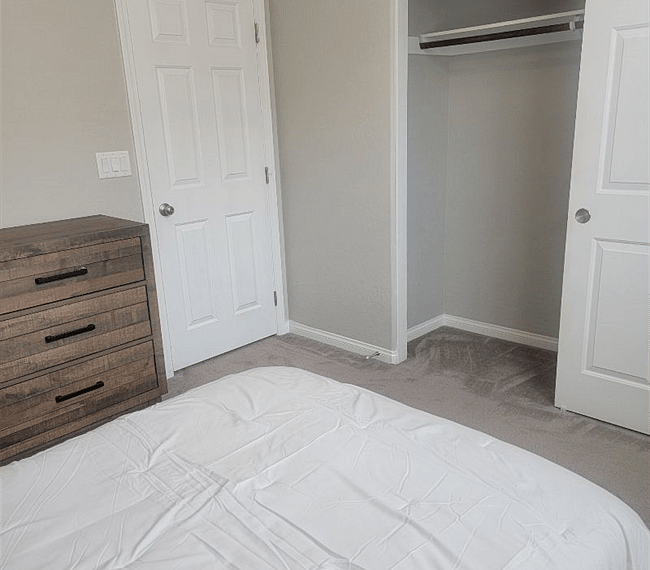 Comfy bedroom with night stand and closet  