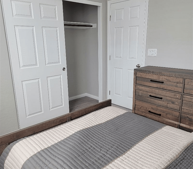 Comfy bedroom with night stand and closet  