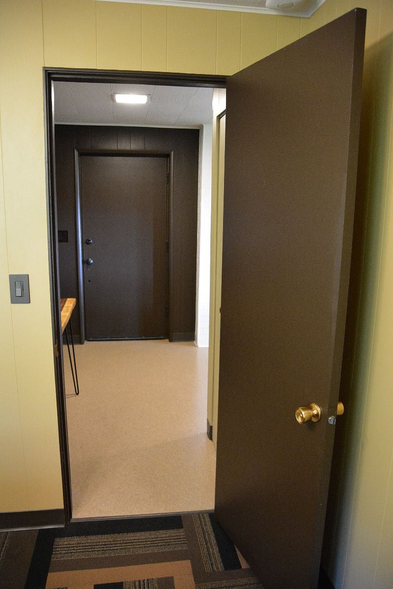 Looking from bedroom toward apartment entry