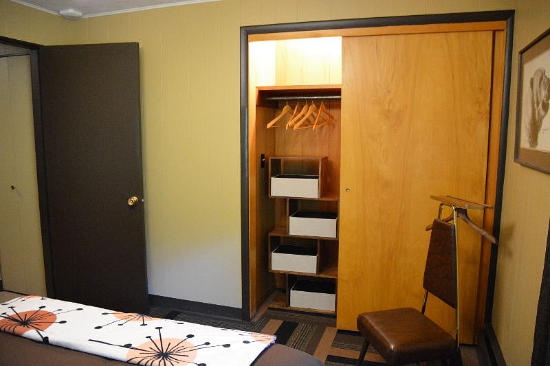 closet with hangers and organizer