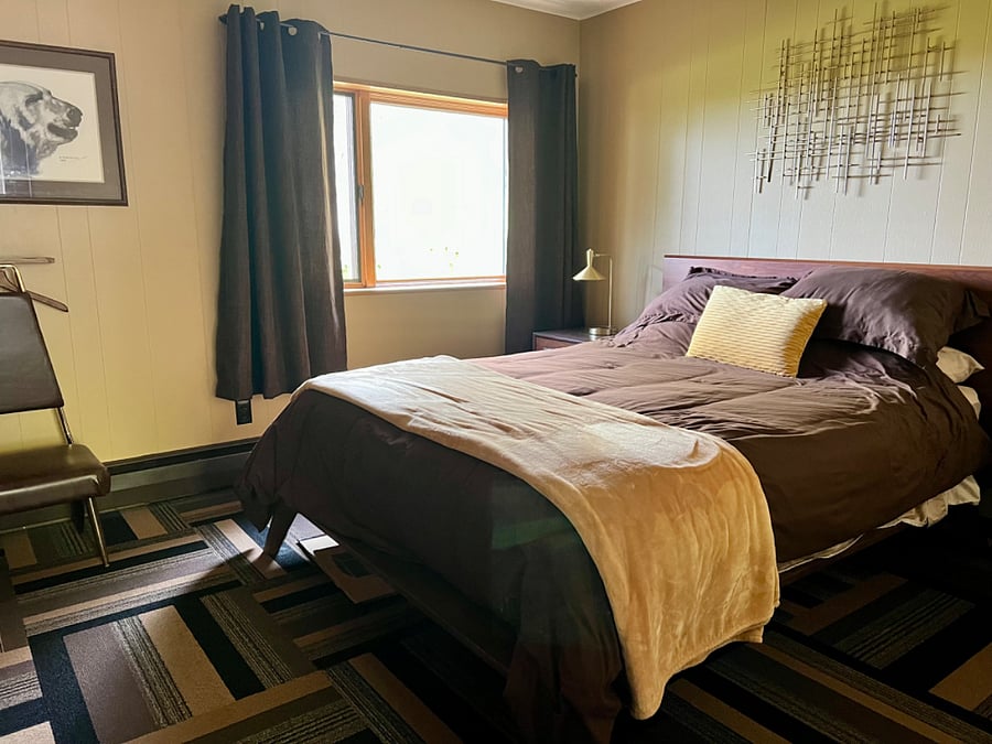 Newer thick queen mattress, quality bedding, twin nighstands, lamps with integrated USB charging ports, black out curtains and full length mirror