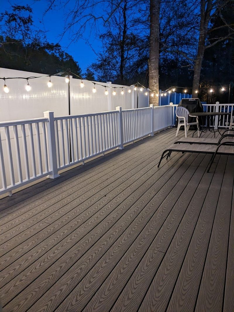 Enjoy quiet evenings on private back deck with string lights providing just the right amount of light.