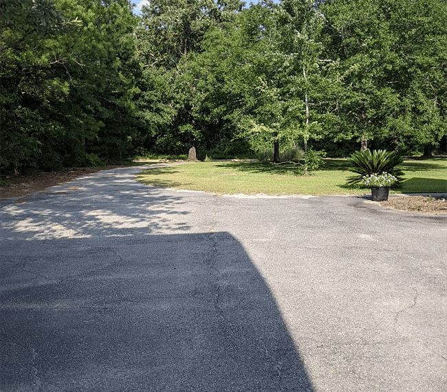 This is the view looking down the paved driveway toward the road.