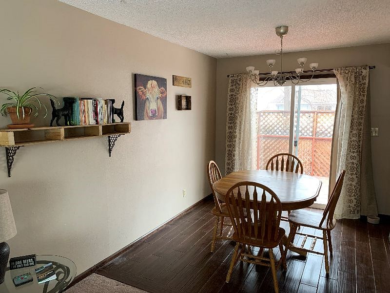 Sliding doors open into the upstairs deck/balcony, that leads into the private backyard and gardens.