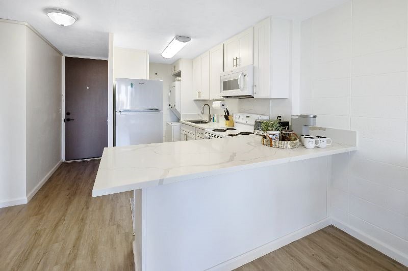 Full kitchen with washer and dryer
