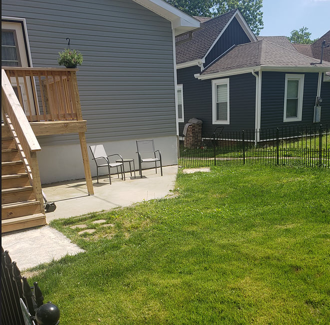 Exterior/side private entrance. This exits into the private yard. Private deck, lower patio and fenced yard.