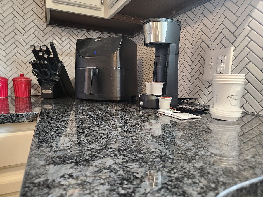 Beautiful granite counters and tile backsplash. Every detail is thought out. All small appliances, serveware, bakeware, linens, etc. are provided