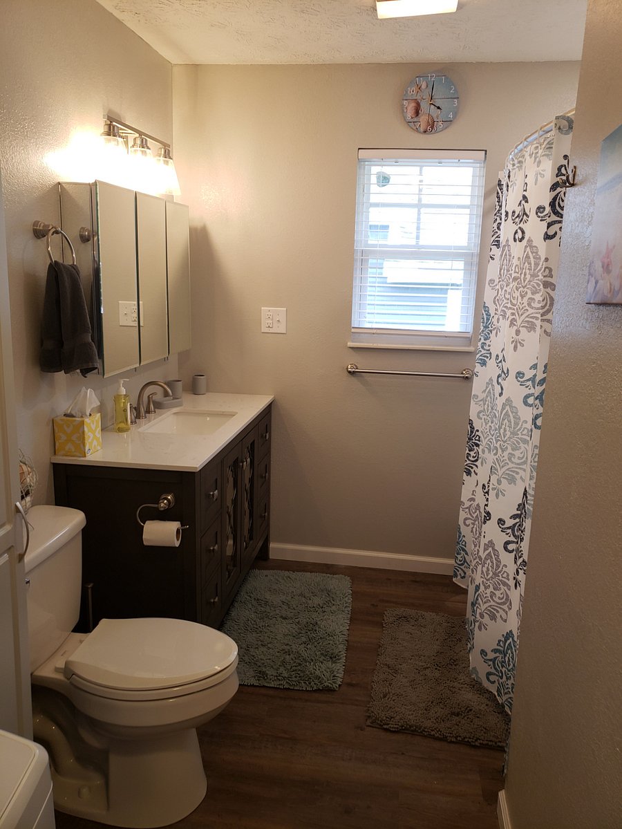 Bathroom with tub/shower. Washer and dryer in bathroom.