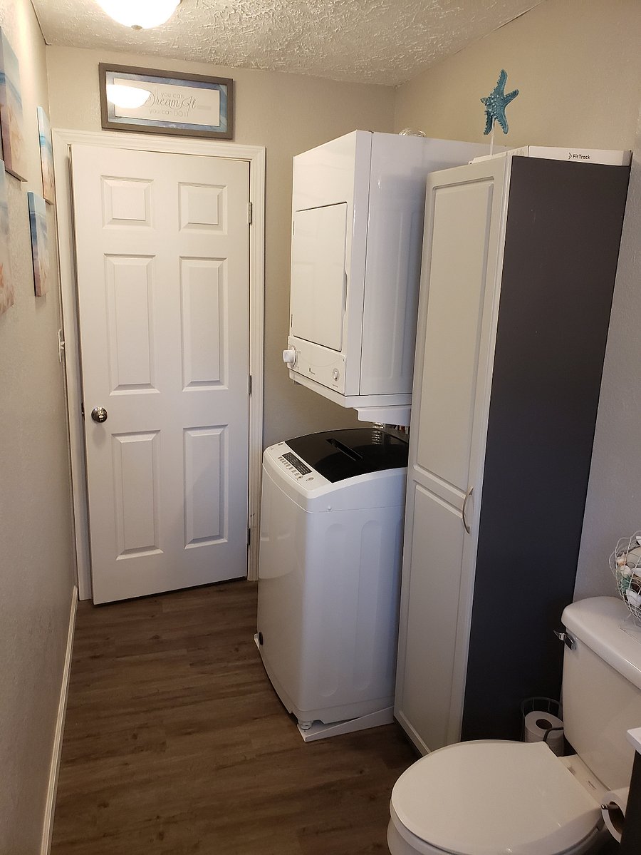Bathroom with tub/shower. Washer and dryer in bathroom.