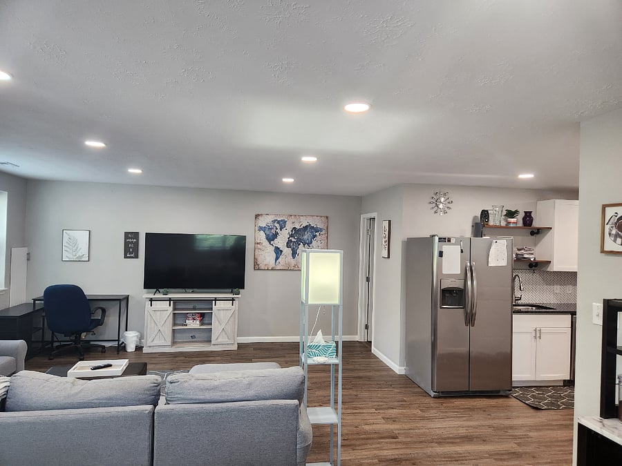 Huge, comfy sectional couch for evening movies or afternoon naps! Open floor plan to dining and kitchen.