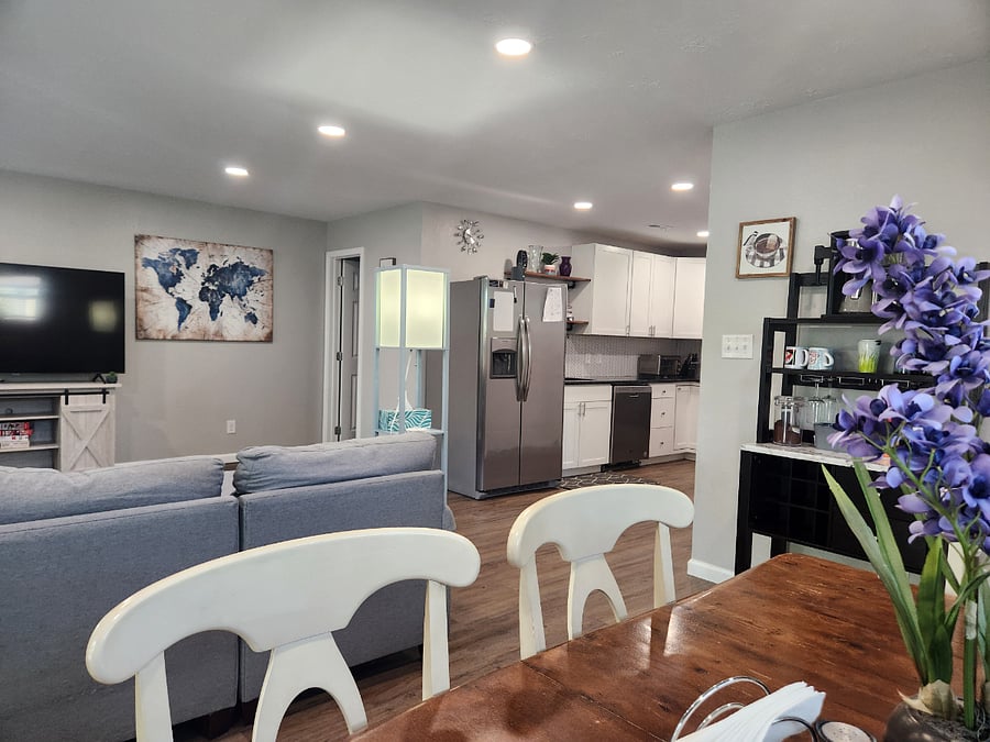 Huge, comfy sectional couch for evening movies or afternoon naps! Open floor plan to dining and kitchen.