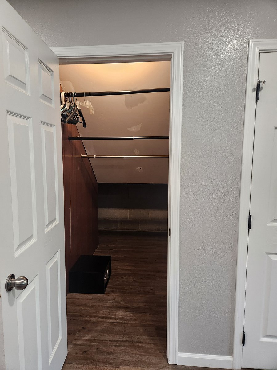 Additional under stair storage. Access door in kitchen area.