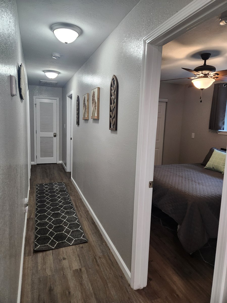 Hall back to bedroom and bathrooms.