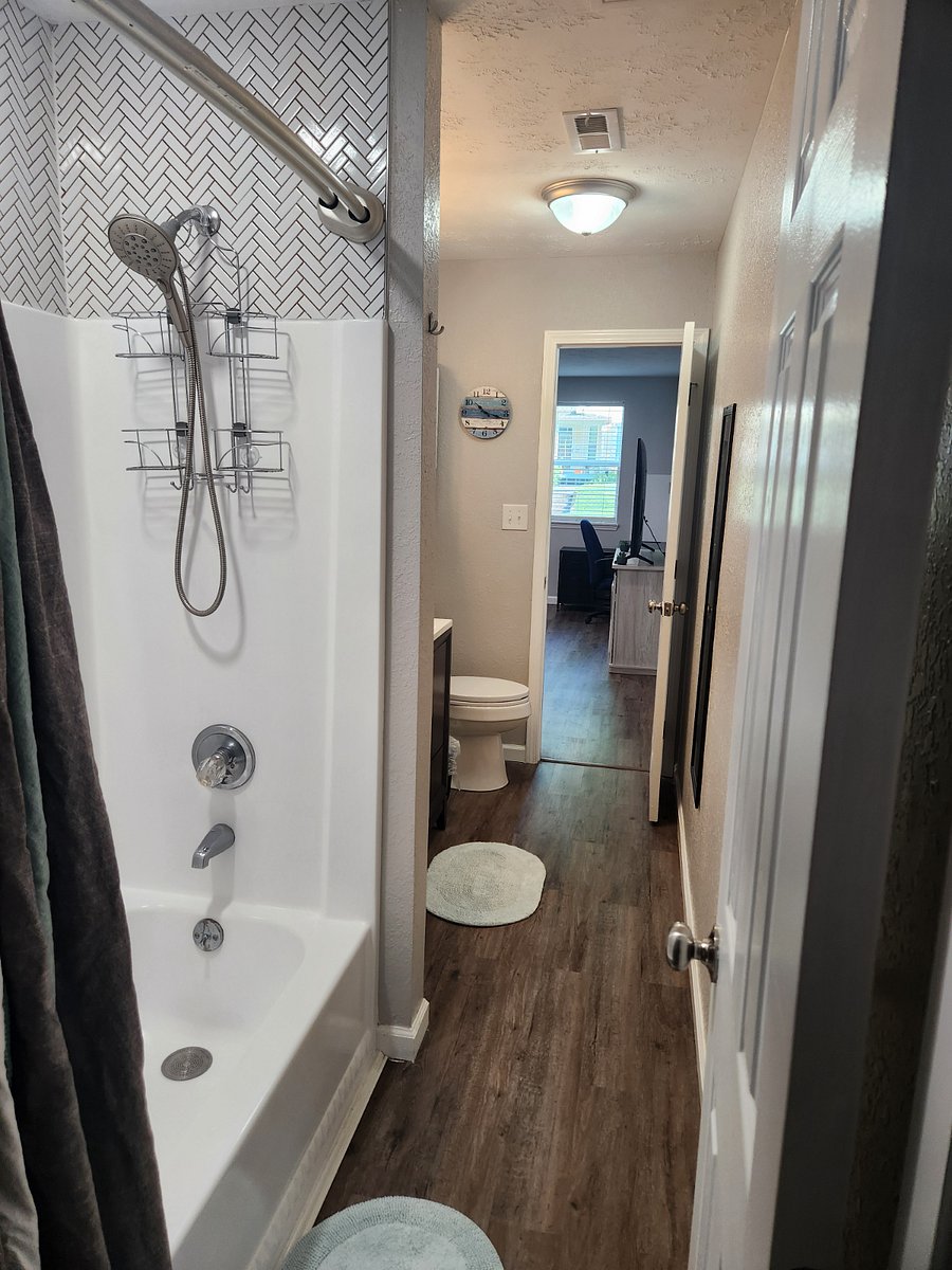 Bathroom attached to king bedroom and opens to livingroom. Full tub/shower. Lots of storage and all linens provided.