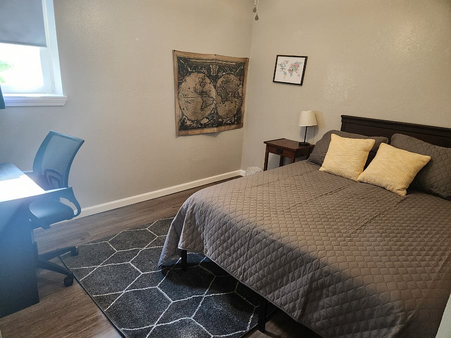 Guest bedroom 1 - queen size bed, large closet & 2nd dedicated work space in the house. Room has dark out shade and curtains.