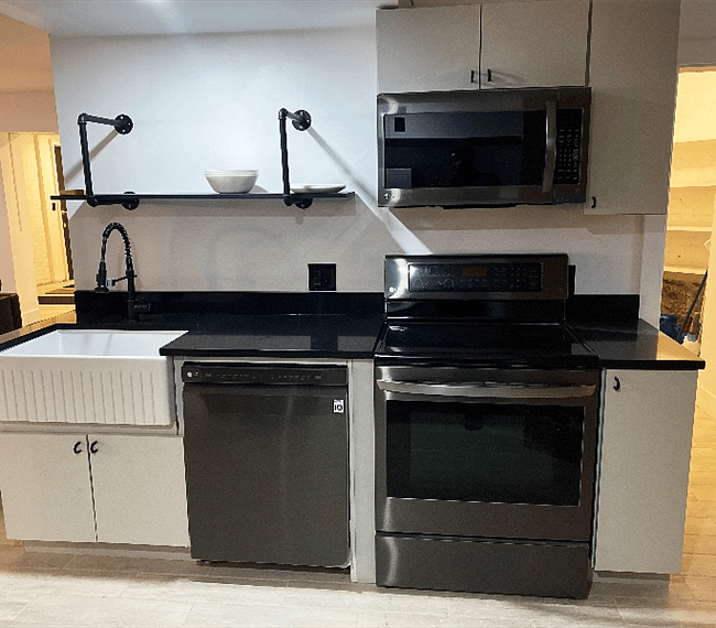 Kitchen: microwave, dishwasher, electric range, farmer's sink, refrigerator