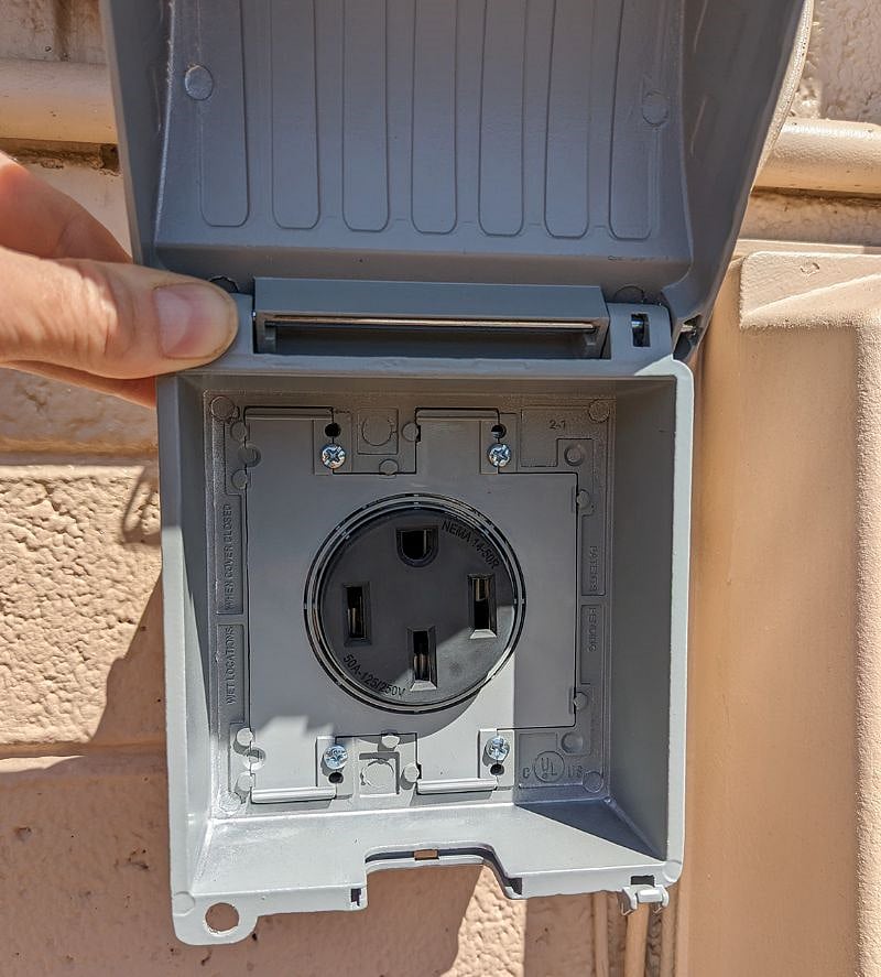 50 amp, 220 volt outlet for EV charging. Ten feet from parking space.
