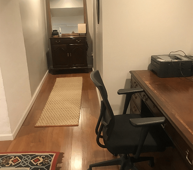 Bonus space with office equipment, clothing racks, and storage area.
