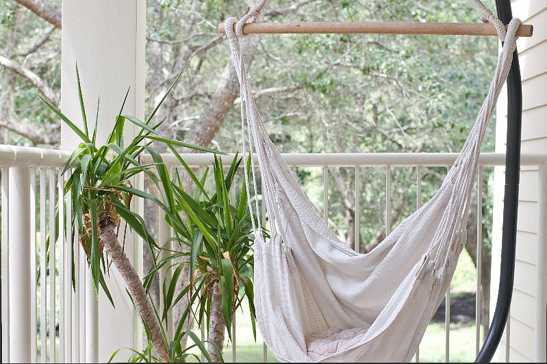 Swinging lounge chair on private balcony