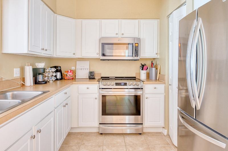 Full kitchen with stainless steel appliances and everything needed to cook or bake.
