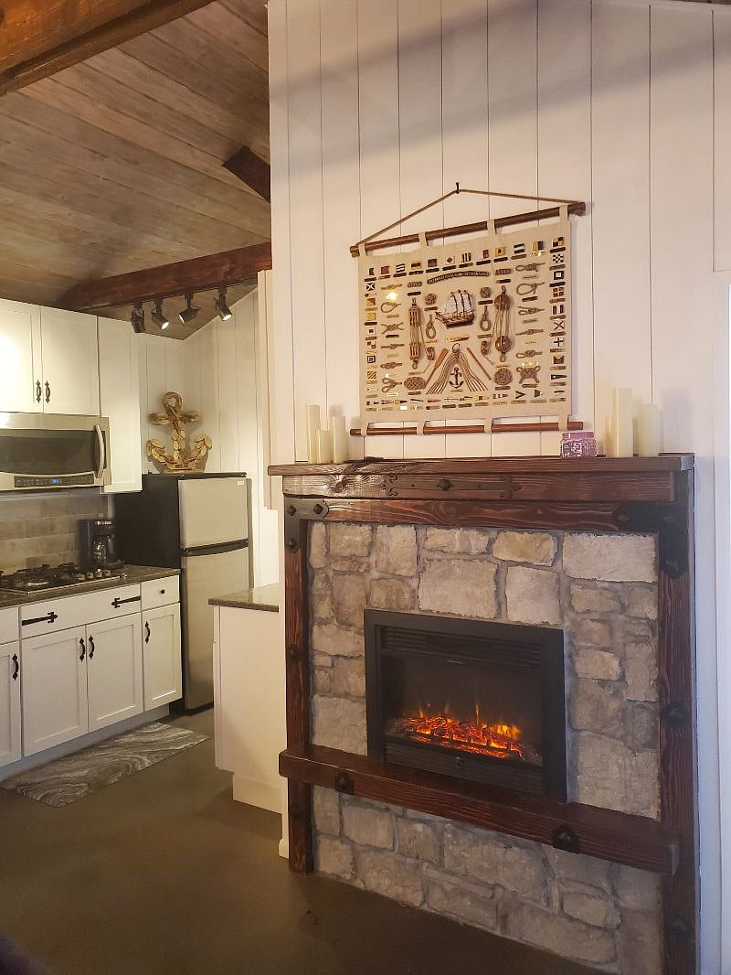 Fireplace and kitchen.