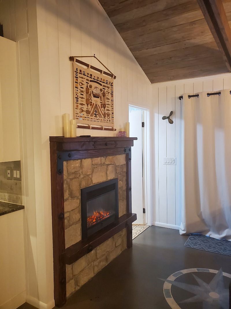 Fireplace and door to bathroom.