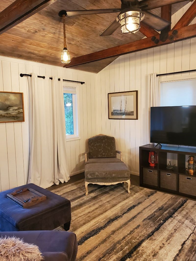 Plenty of windows/light, storage in TV stand, comfy seating.