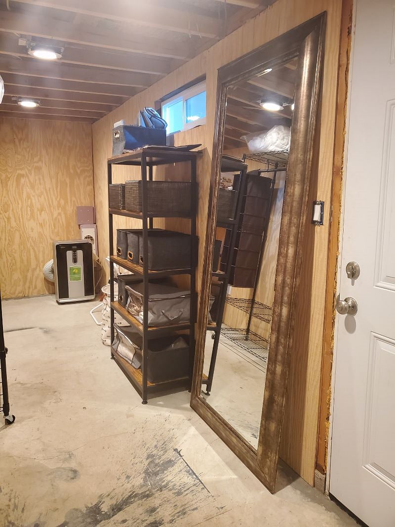 Storage area also includes a full length mirror.