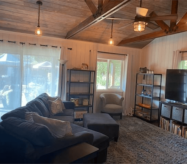 Old photo, but another view of living room area. Shows the high ceilings.