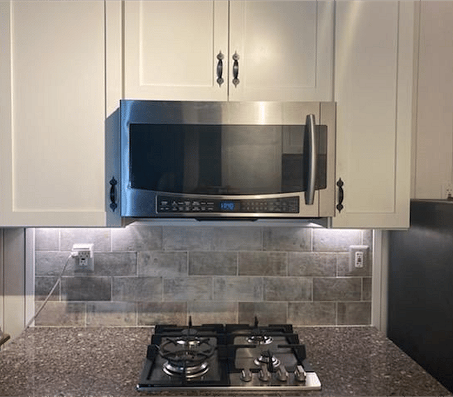 Convection Microwave and 4 burner stove top.
