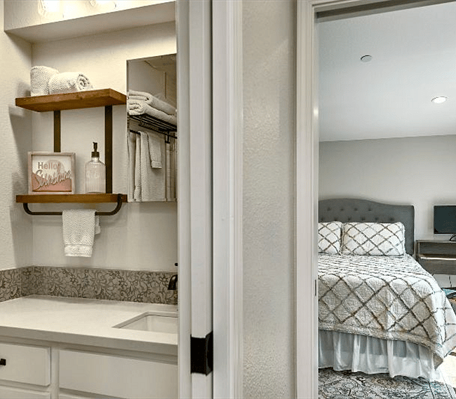 View of bathroom and bedroom from kitchen