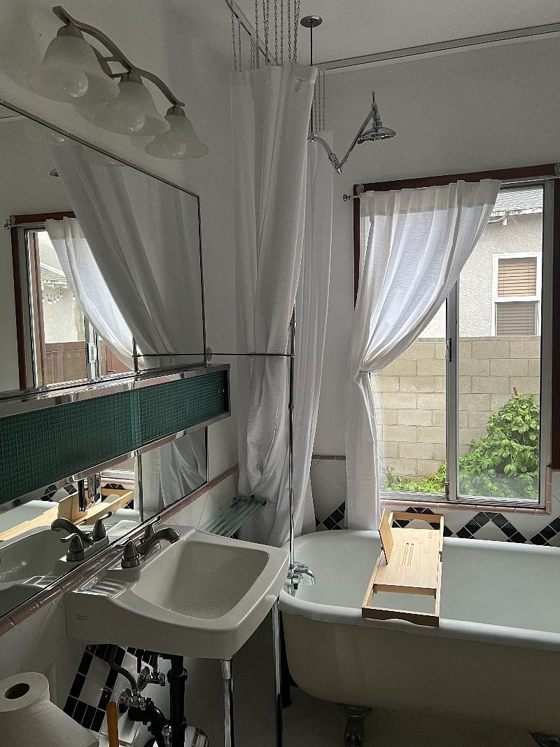 Large bathroom
with cast iron tub and shower