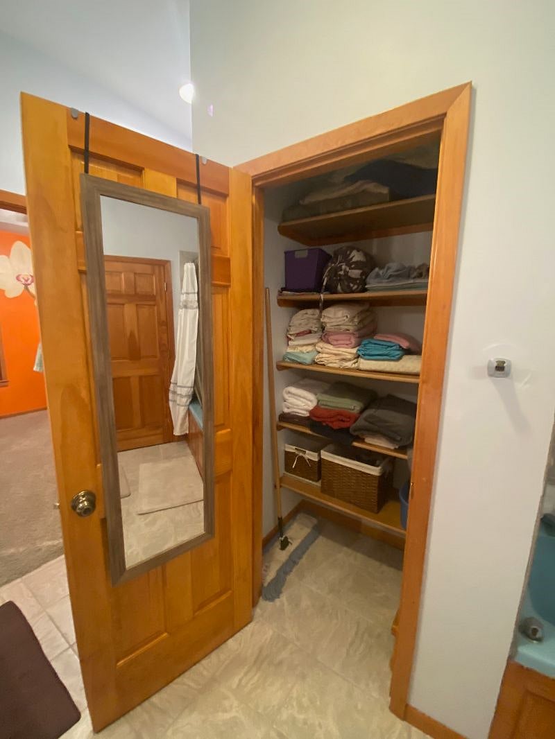 Linen closet with sheets, towels, things to clean with, initial toilet paper