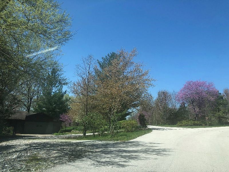 Gravel driveway with 2 car carport and 2 car garage