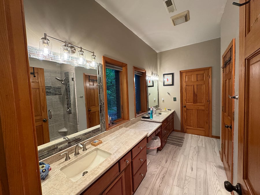 New granite countertop with undermounted sinks, vanities