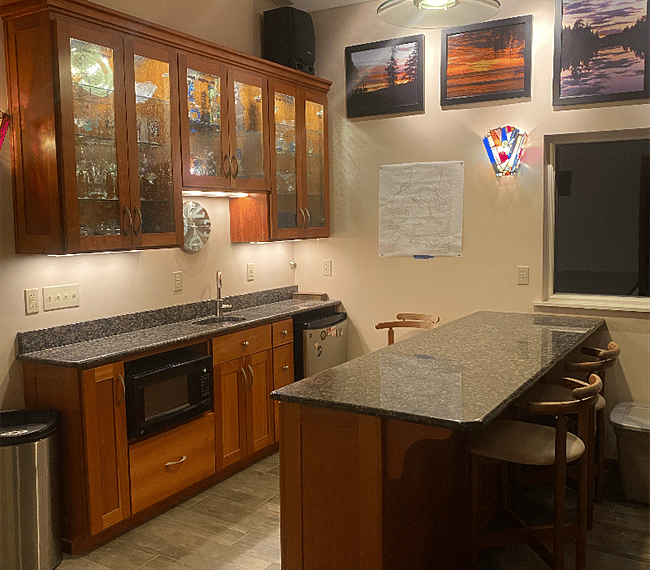 Downstairs bar with minifridge/microwave