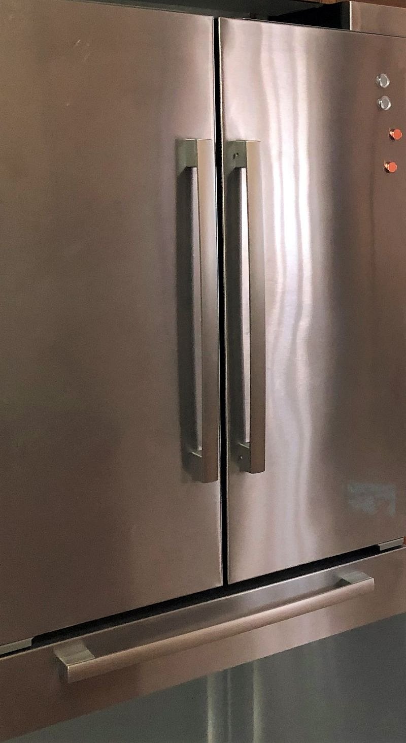 stainless steel side-by-side refrigerator with freezer drawer
