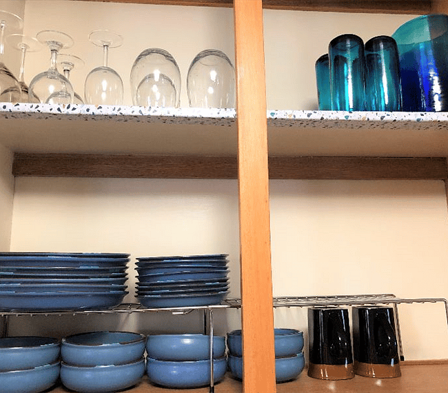 Well-equipped kitchen includes Dansk Blue Mesa stoneware, Crate and Barrel wineglasses, drinking glasses, pitcher, much more