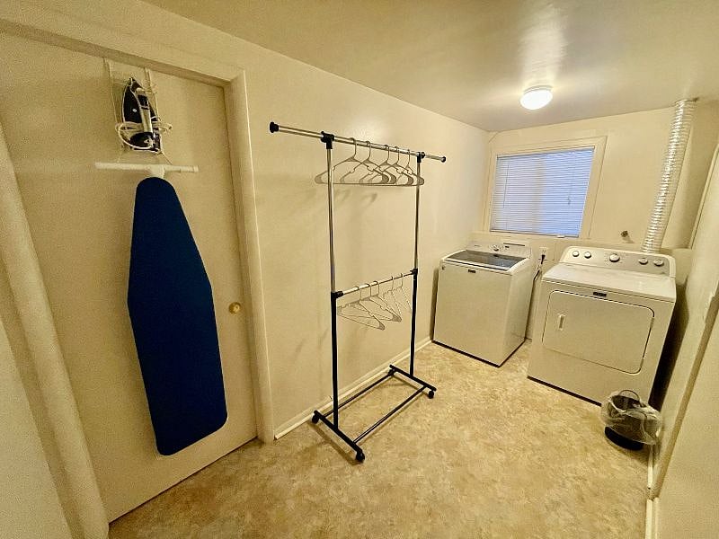 Your own private laundry room includes washer, dryer, iron and ironing board, clothes rack