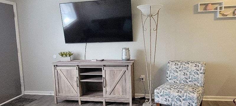 #1. Uptown Condo. Living Room with smart tv.