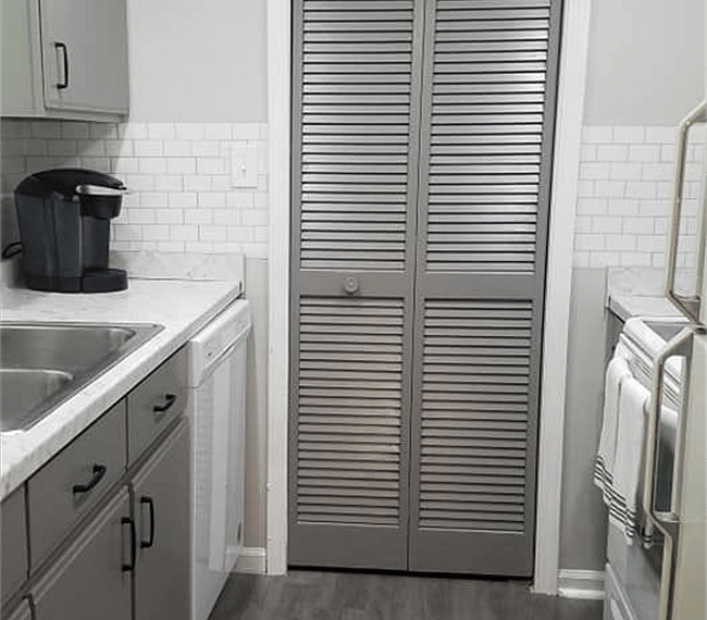 #1. Uptown Condo. Door to laundry area with large pantry