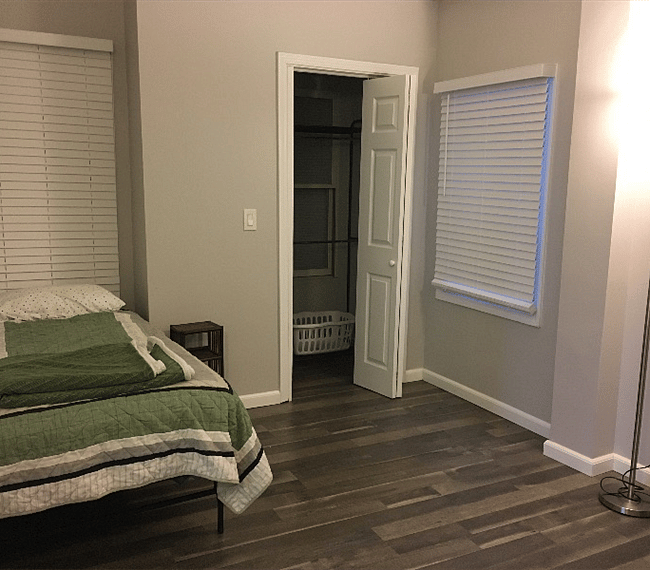 2nd Bedroom with 1 twin bed shelving and closet