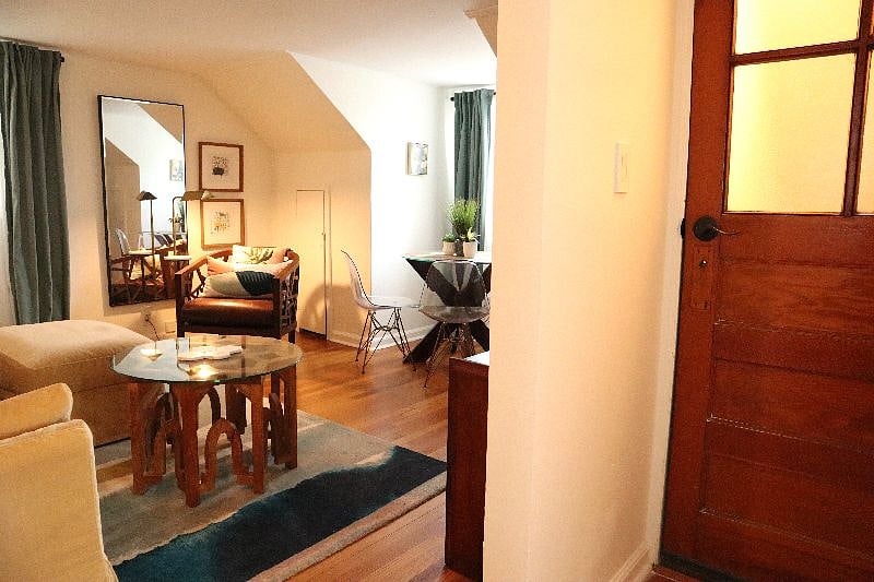 Look into living room, sitting area, and dining area.