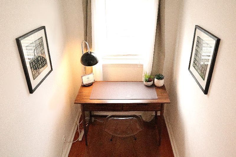 Work area with deck lamp, power strip, and high speed Wifi.