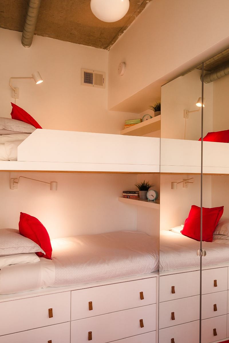 The Flex-Room has tall ceilings, a ceiling mini-fan, six drawers under the beds, and a tall closet with mirrored doors.