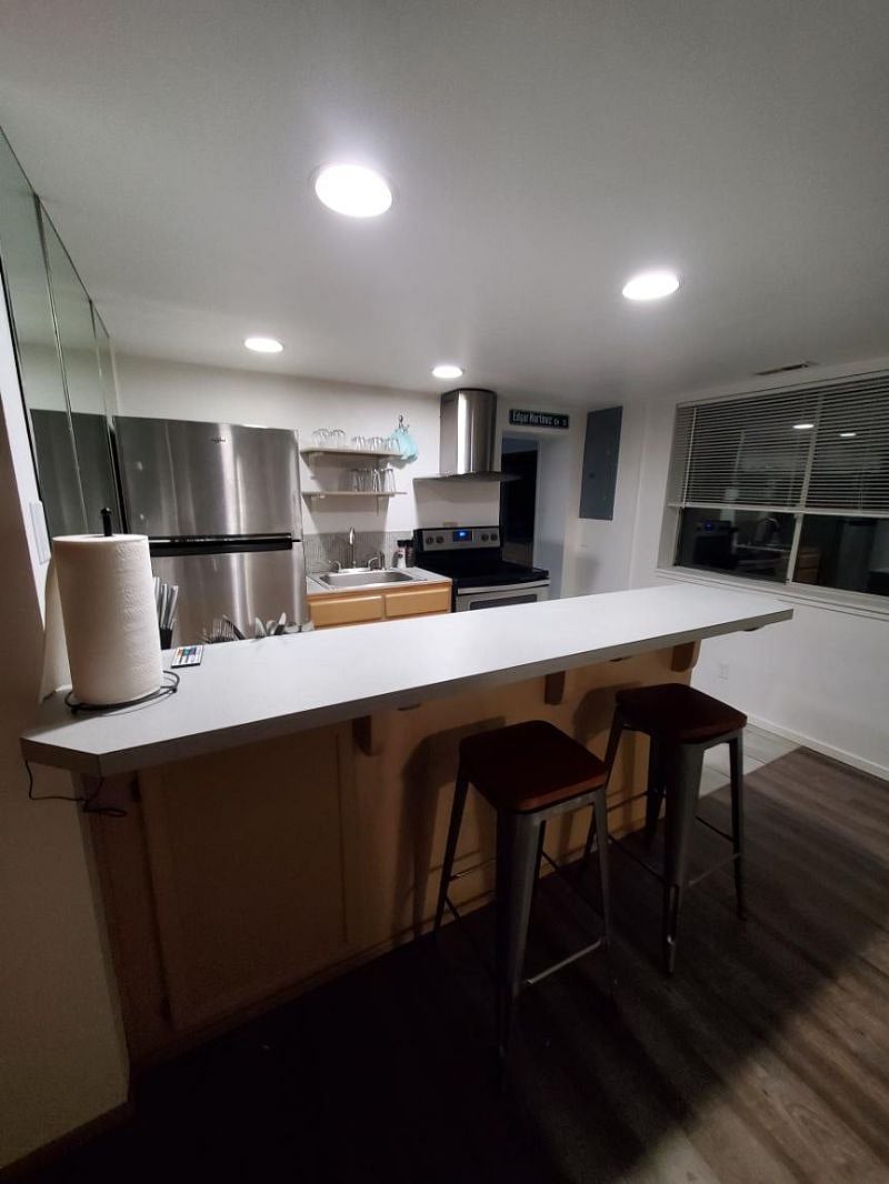 Kitchen view with breakfast bar and barstools