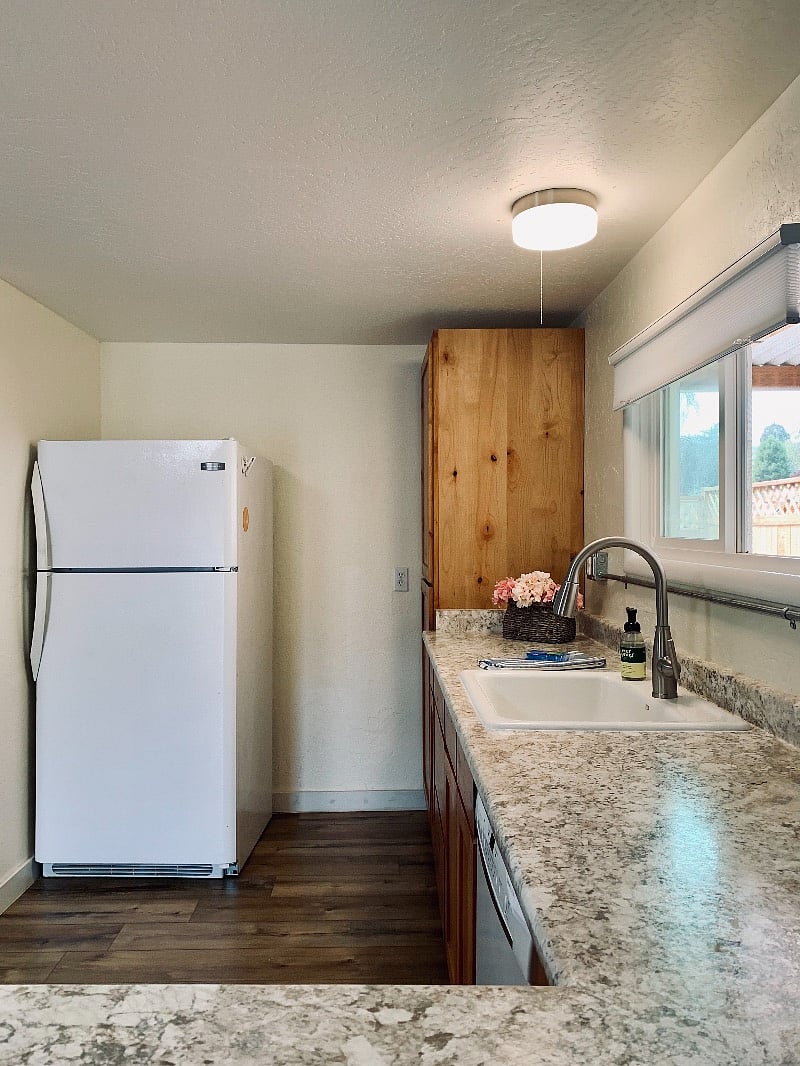 Full size refrigerator, dishwasher, pots and pans, induction hot plate, large toaster oven and microwave. Blender, juicer, and more.