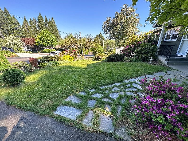 View from driveway (beautiful landscape flourishes especially in the spring and summer!)