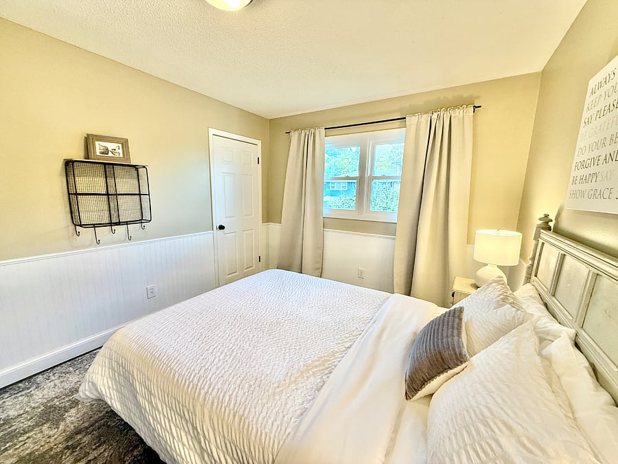 Second bedroom with queen bed and designated work space.