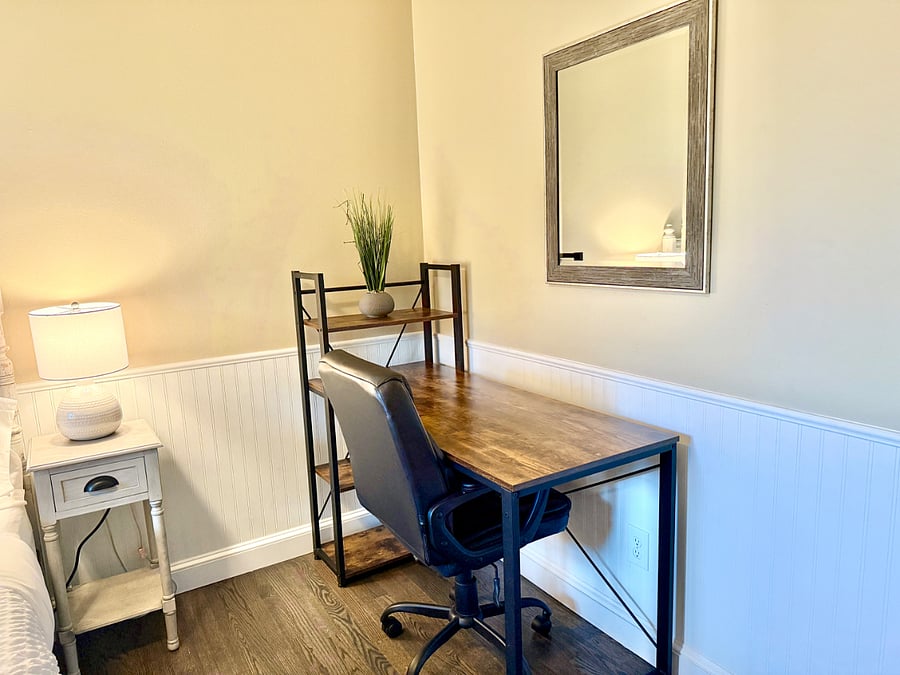Second bedroom with queen bed and designated work space.